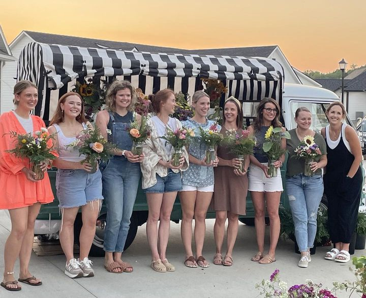 Flower event for friend group, nine women standing with flowers in front of Sallie the Flower Stem Bar Truck in Columbia, MO Flower event for friend group, nine women standing with flowers in front of Sallie the Flower Stem Bar Truck in Columbia, MO