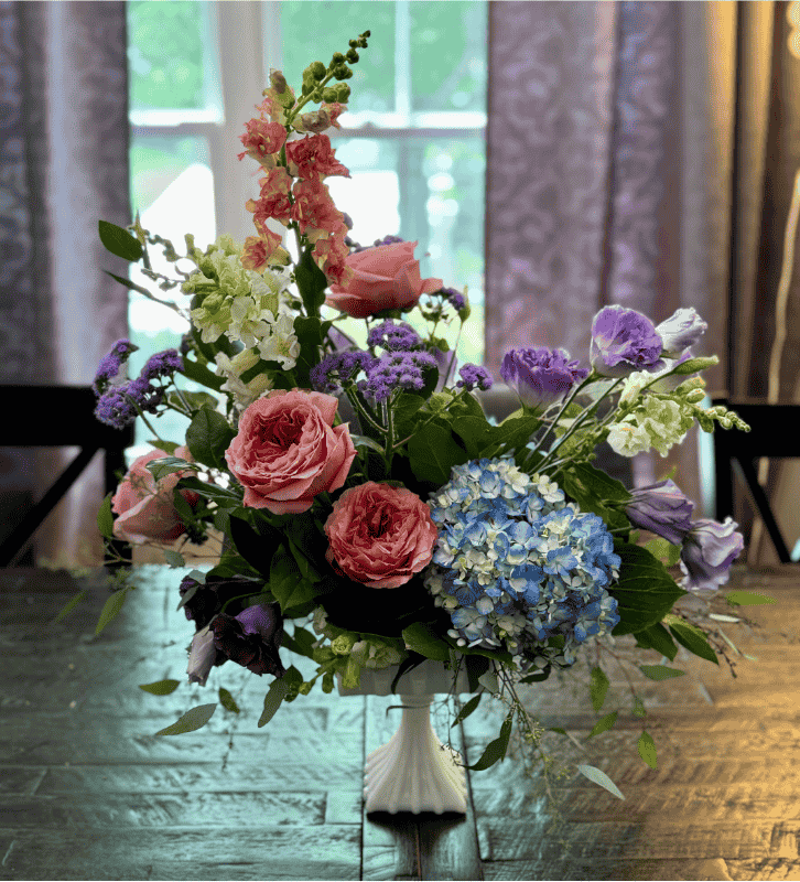 Spring flowers in a white vase